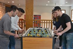 A round of foosball for old time's sake on Young Alumni Day.